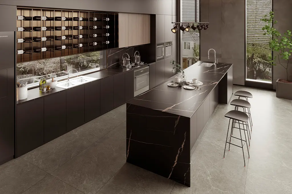 black kitchen with black marble and finishes golden